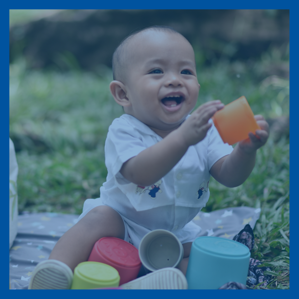Child playing with large blocks