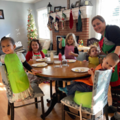 A group of children decorating Christmas cookies