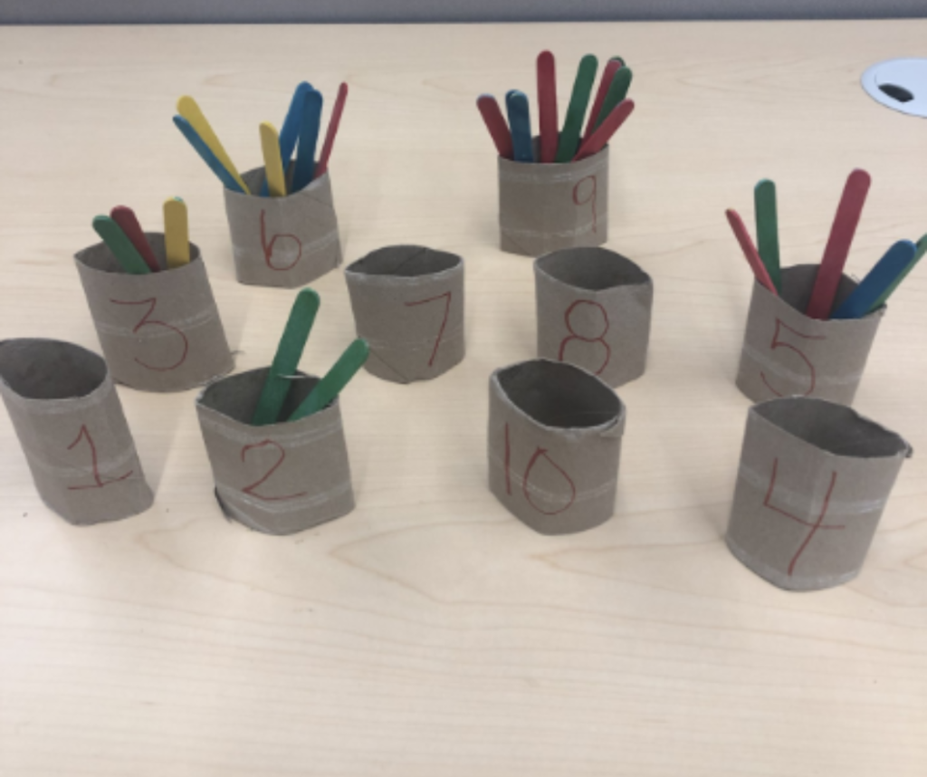 cardboard tubes make an excellent counting activity with craft sticks