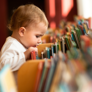 A child looking through books