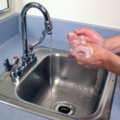 A person washing their hands