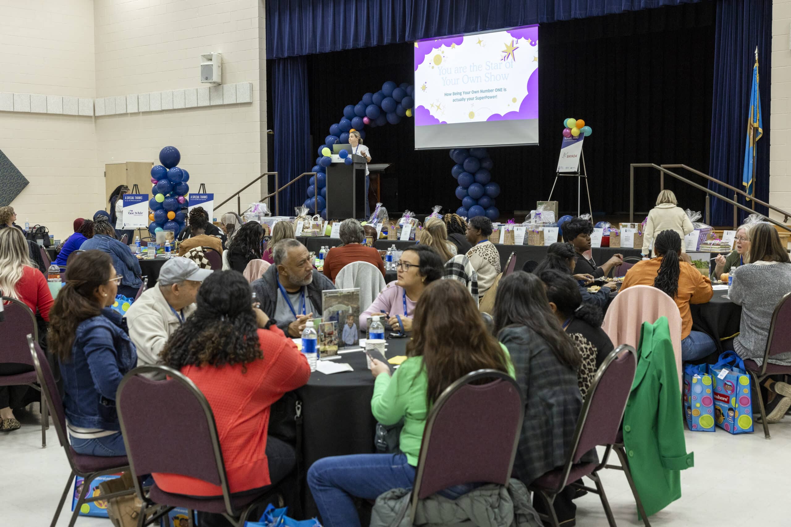 A group of educators sitting at tables at a conference